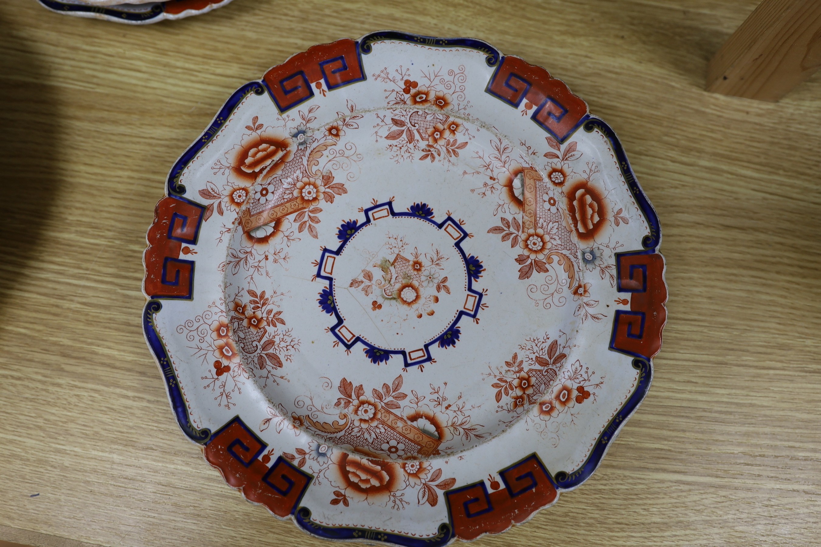 Eight early 19th century English 'Stone China' circular plates with cream, red and white decoration and six matching soup bowls